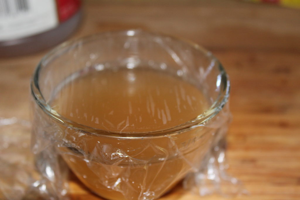 Cover container with cling wrap making sure it's tightly attached so the flies can get in but they can't get out.