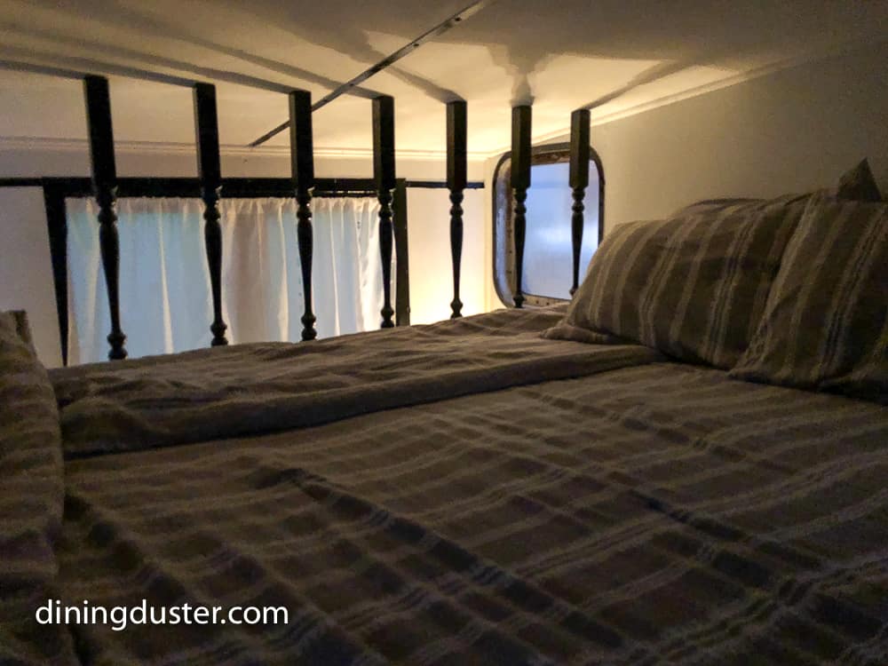 queen bed in caboose upstairs