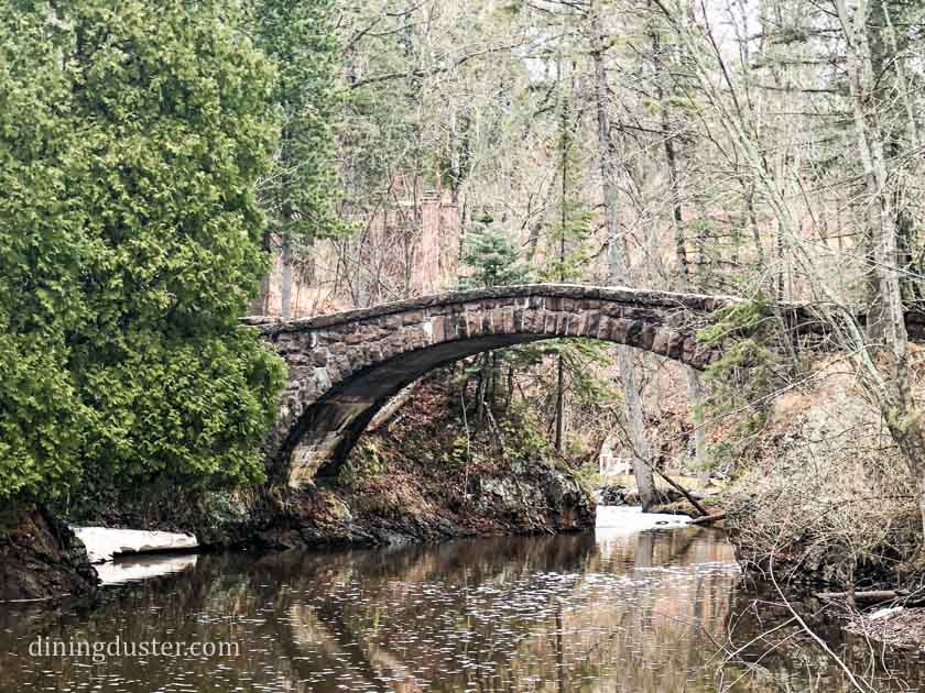 stone arch bridge at glensheen mansion