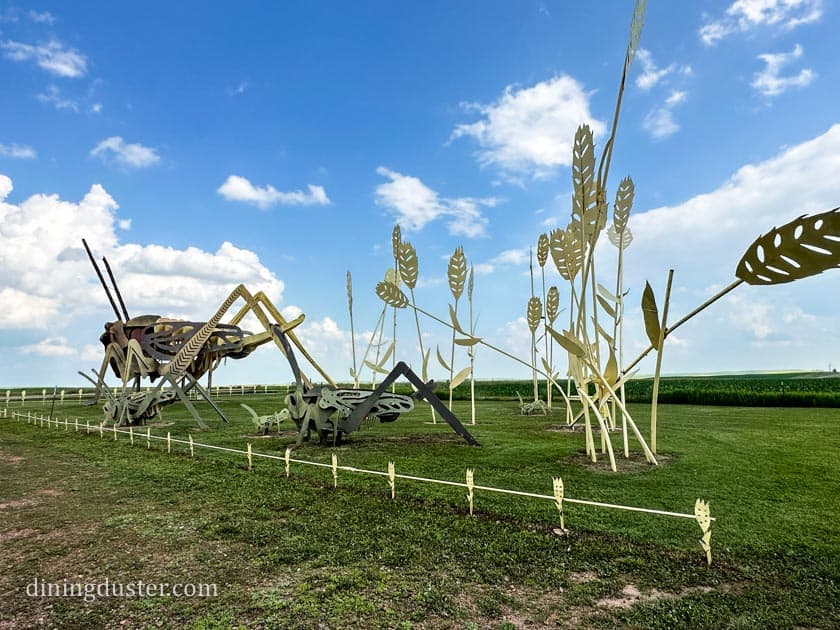 grasshoppers enchanted highway sculpture in north dakota