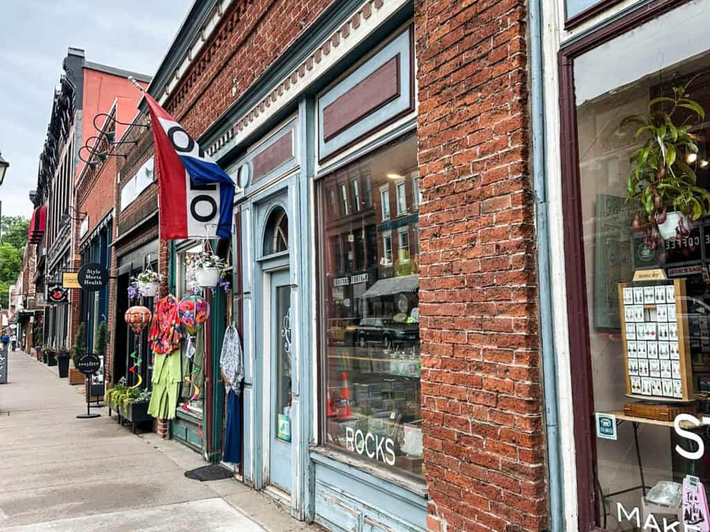 main street in historic downtown stillwater, mn with brick buildings and boutique shops