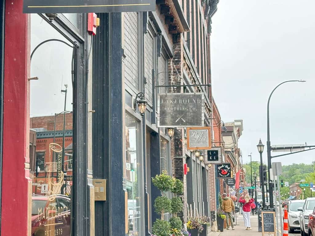 main street in historic downtown stillwater, mn with brick buildings and boutique shops
