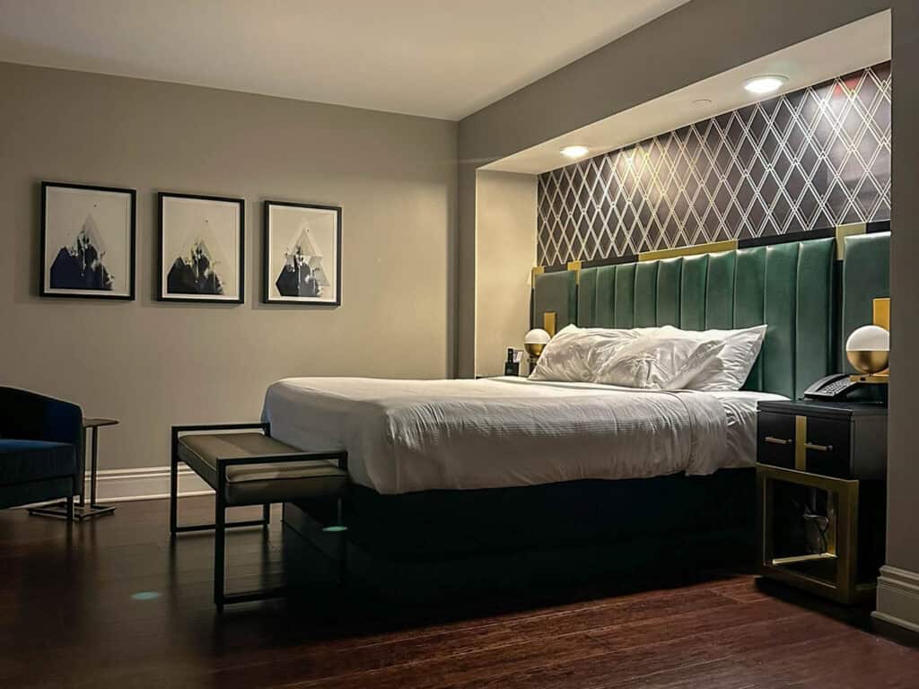 Plush guest room at The Warrior Hotel with modern amenities and historic charm