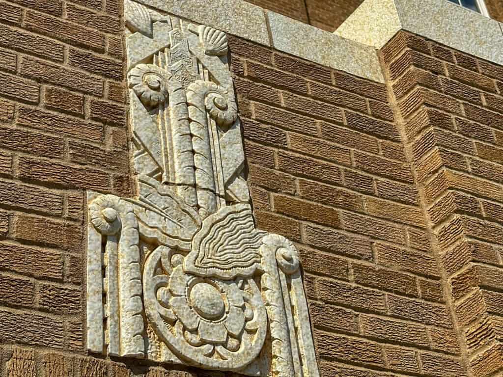 art deco details on exterior wall of The Warror Hotel in SIoux City