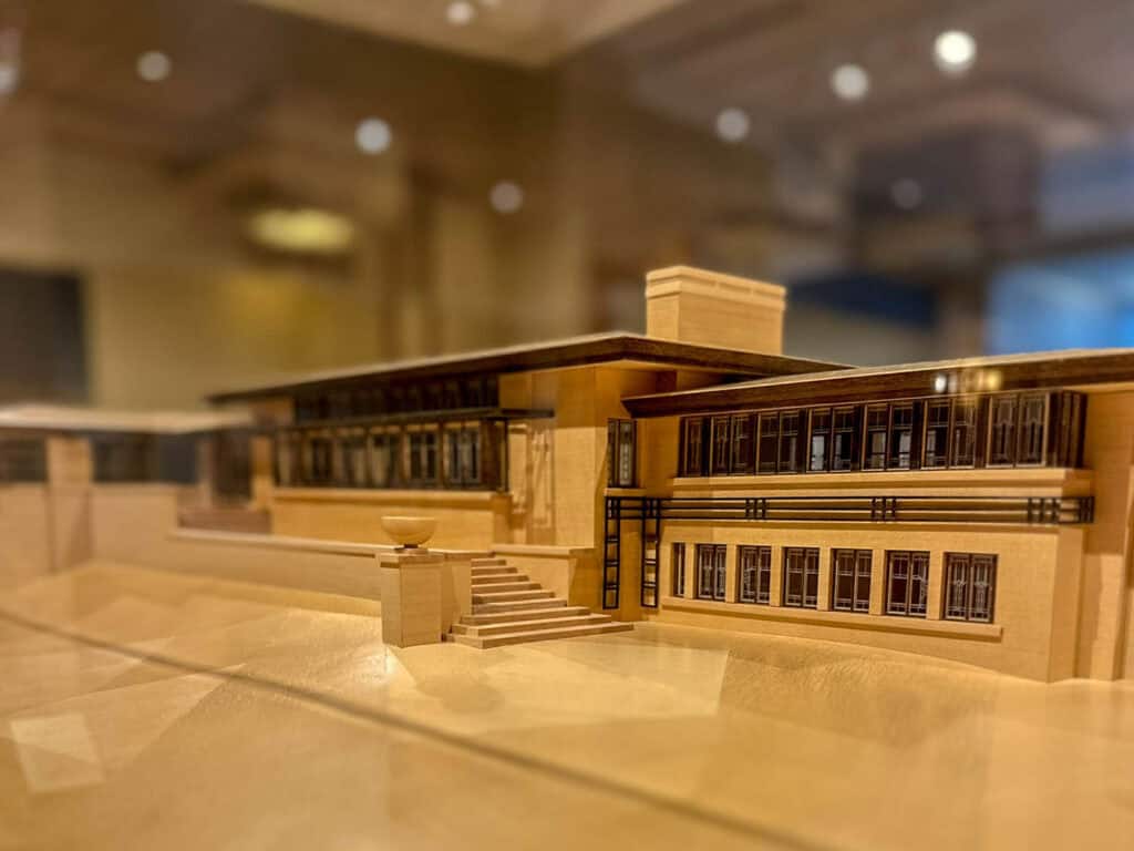 Detailed miniature architectural model of a building with stairs and windows.